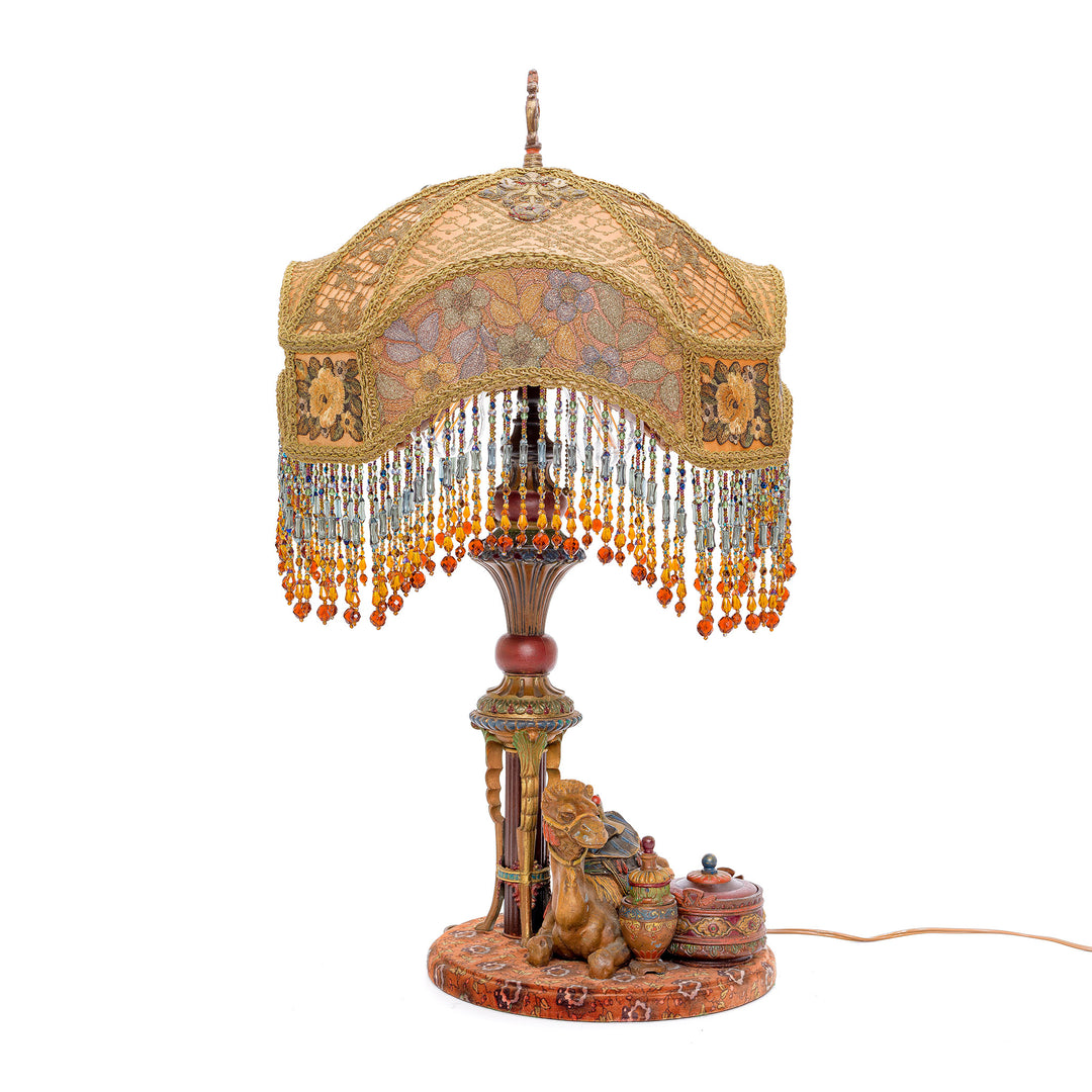 Vintage lamp with bronze base and hand-embroidered shade.