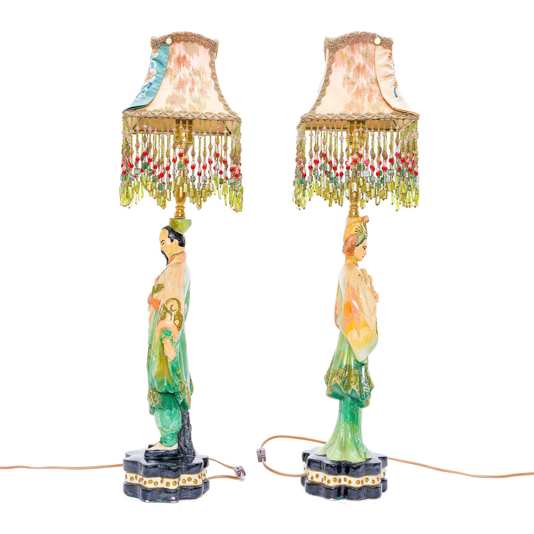 Unique lamp duo featuring hand embroidered shades with cultural motifs.