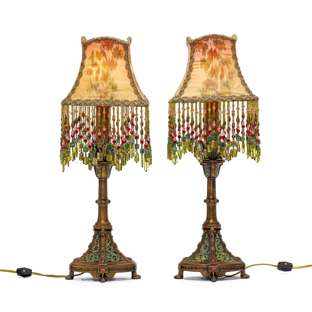 Elegant early 20th-century bronze lamp with hand-beaded craftsmanship.