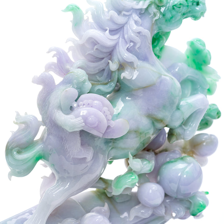 Motion captured in jade with this carved stallion and monkey rider sculpture