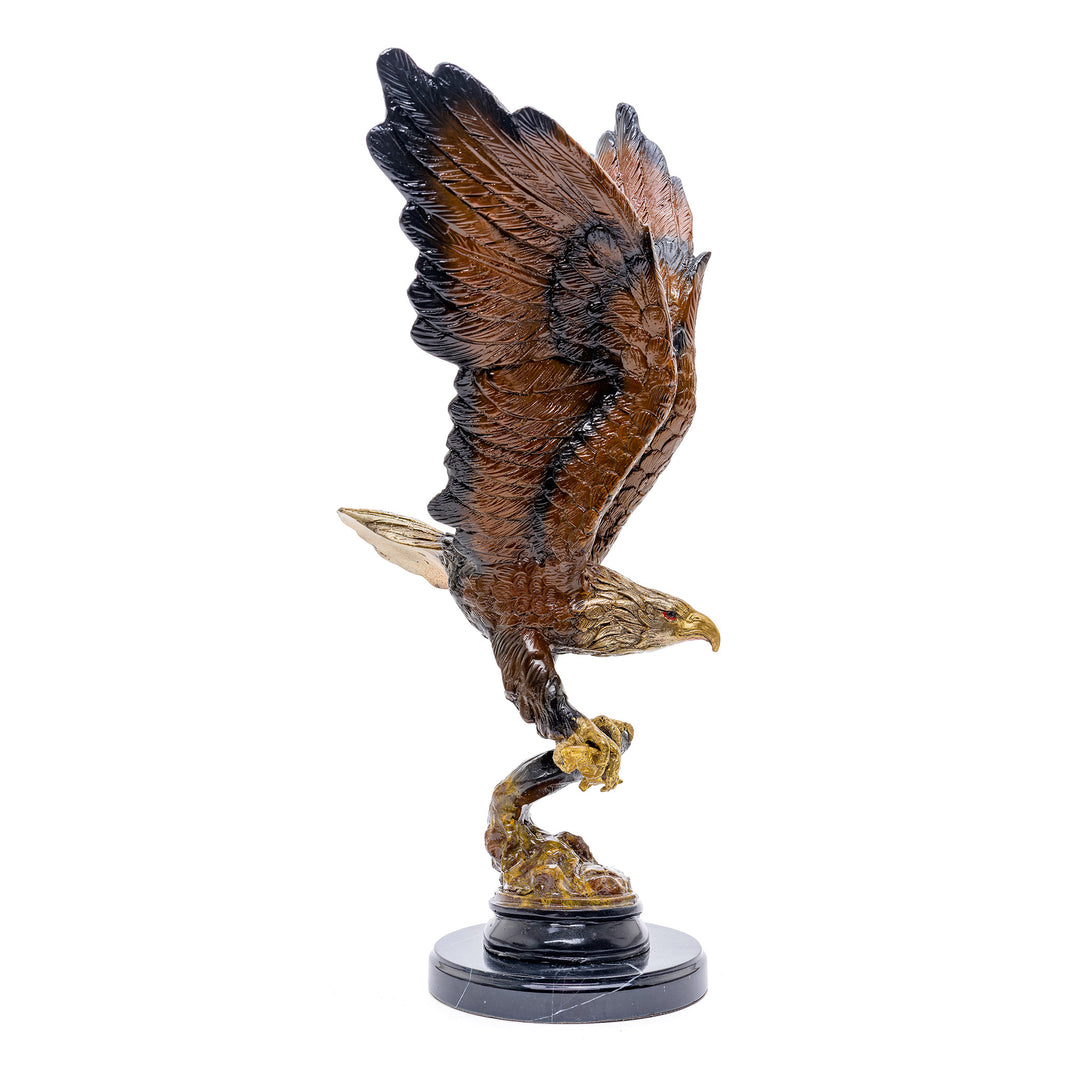 Bronze sculpture of an eagle in flight with a fish in its talons