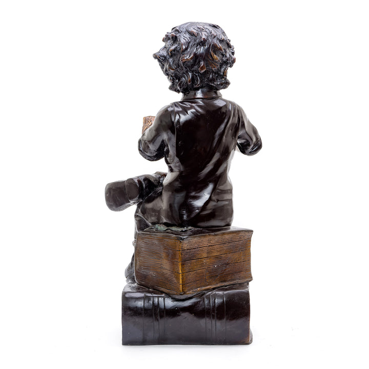 Bronze Figurine of Child Reader on Book Pile.