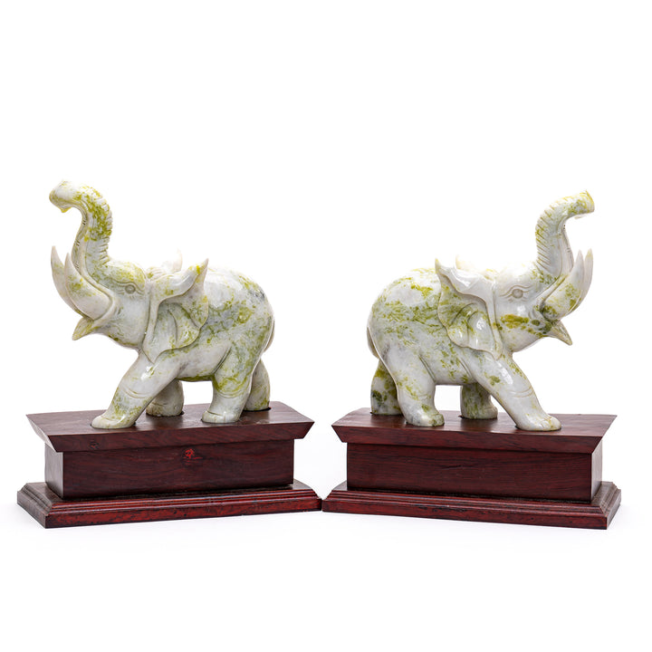 Traditional carved elephant pair symbolizing prosperity and wisdom.