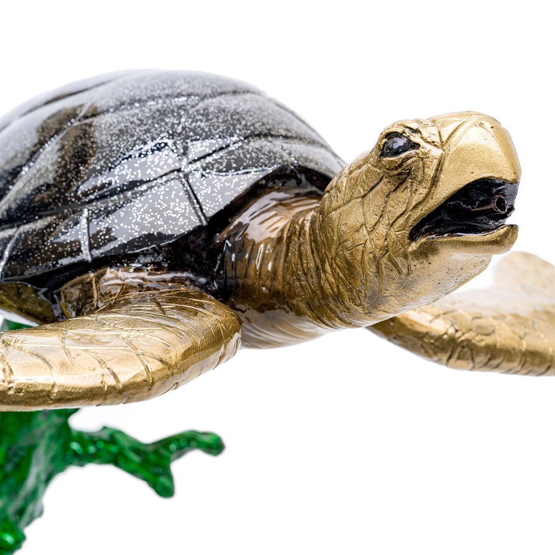 Bronze turtle sculpture in seaweed and coral design.