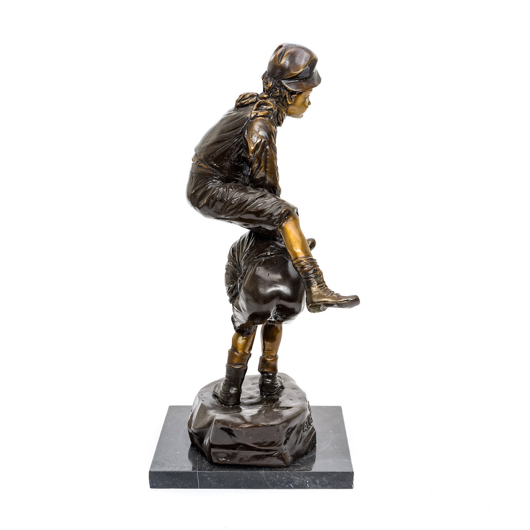 Playful childhood scene in bronze