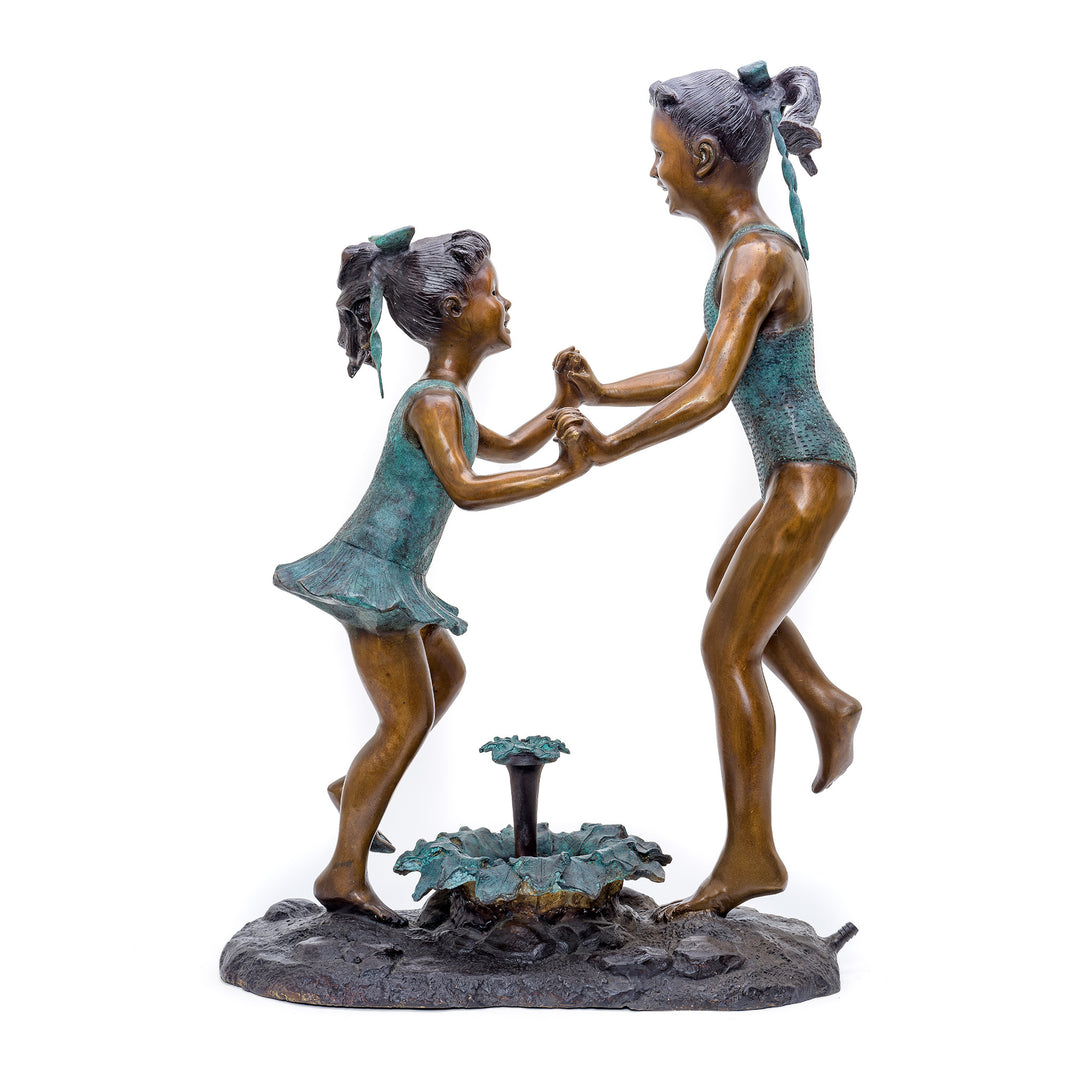 Bronze Sculpture of Two Girls Dancing Around Fountain.