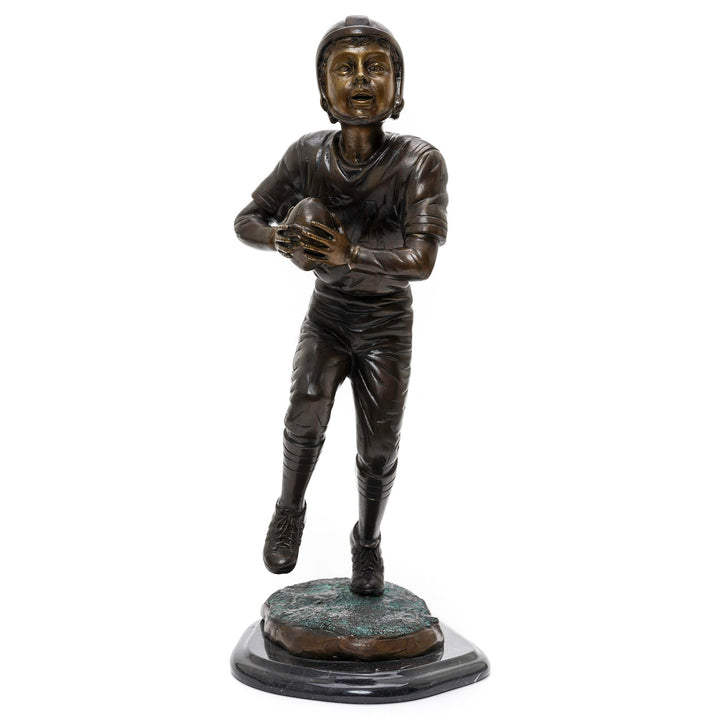 Bronze sculpture of a young American football player on marble base ready for a touchdownBronze statue of a young American football player on marble base