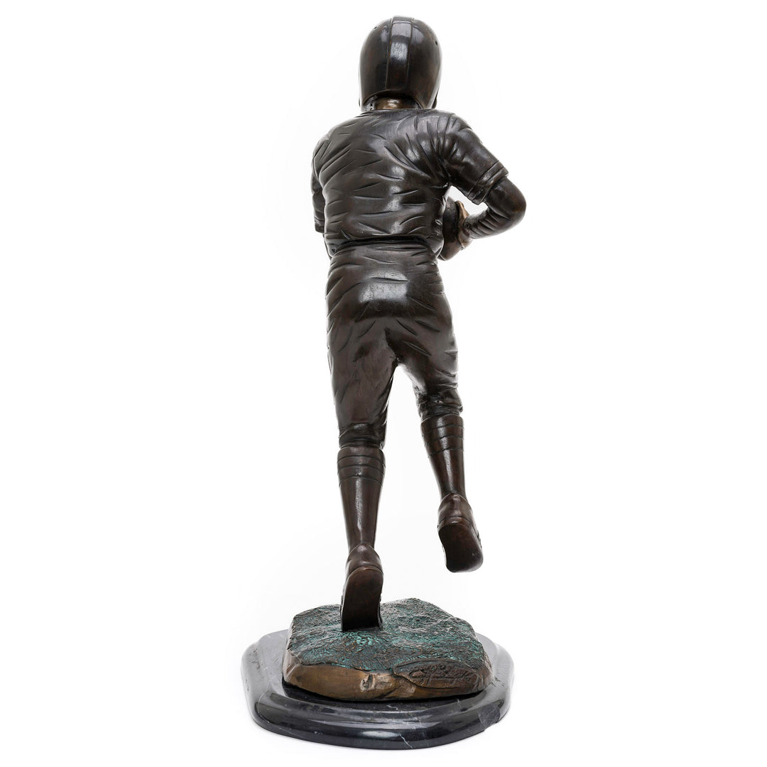 Intricately detailed American football boy sculpture depicting the passion of the sport