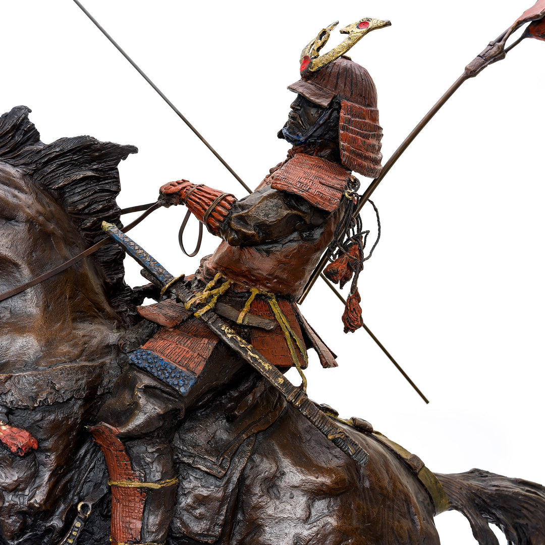 Close-up of samurai warrior on rearing horse in bronze