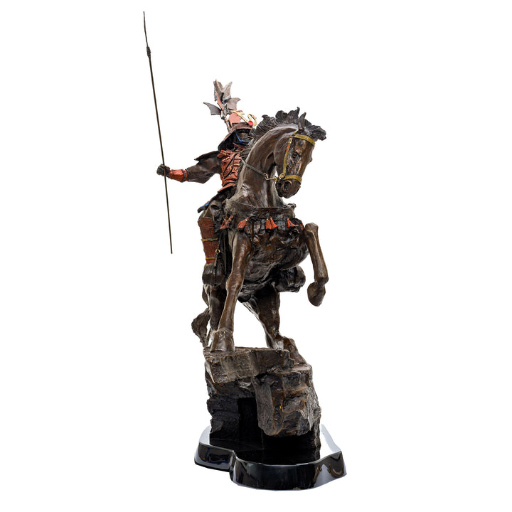 Side view of intricate samurai bronze sculpture