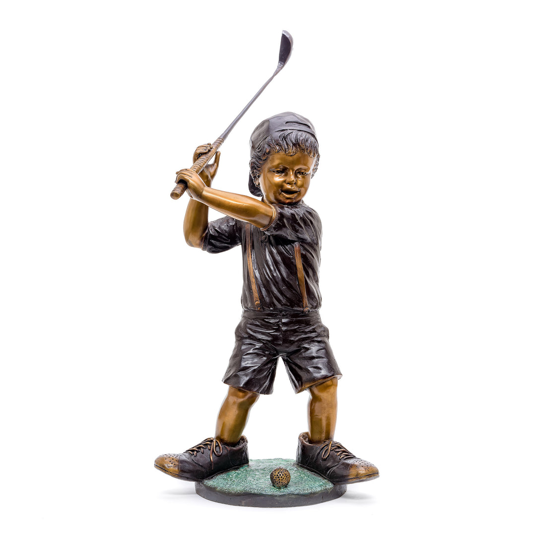 Bronze statue of a joyful young golfer in mid-swing