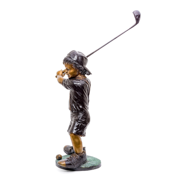 Lifelike bronze sculpture of a boy enjoying golf