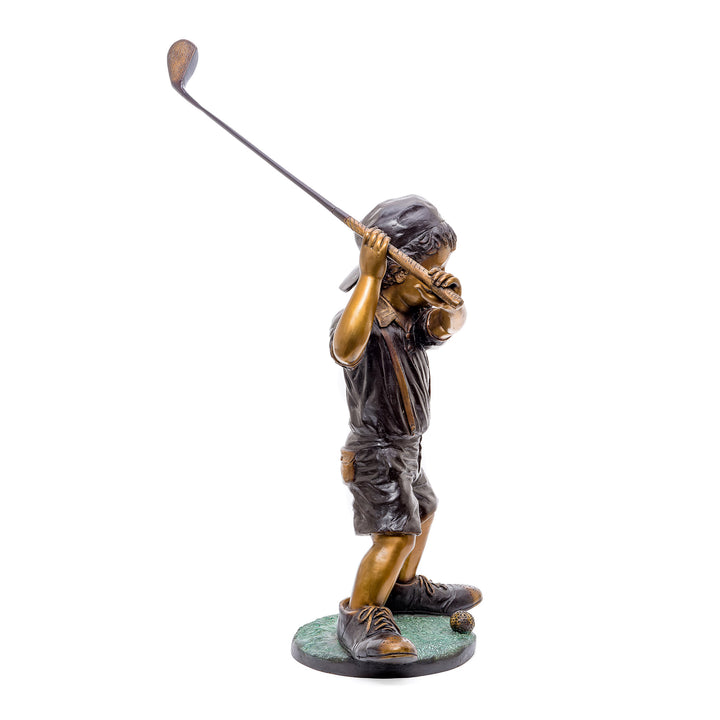 Young golfer captured in fine bronze on the green