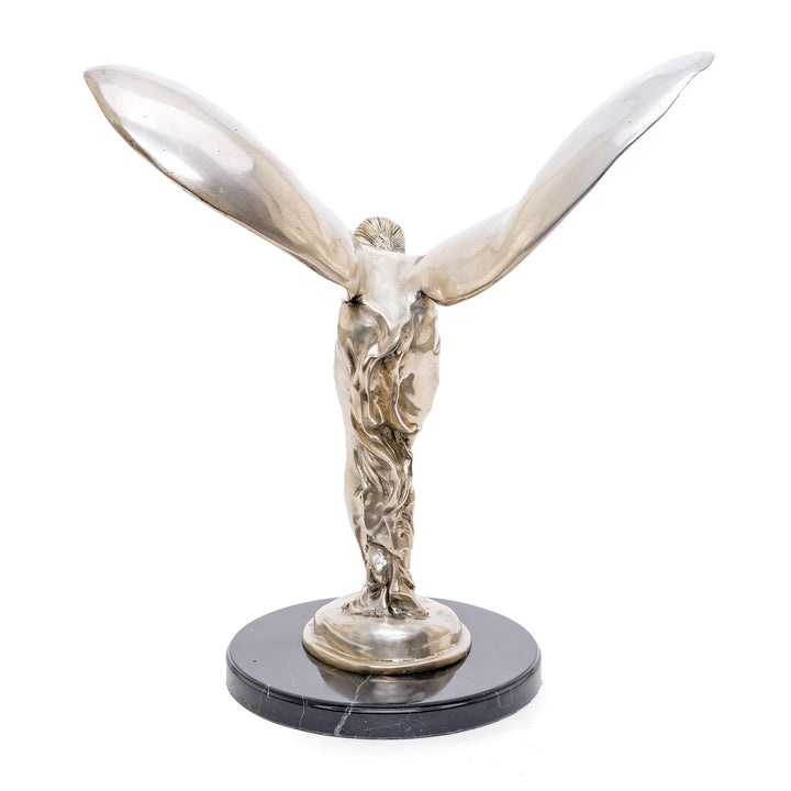 Sophisticated silver-finished bronze statue enhancing upscale interior decor