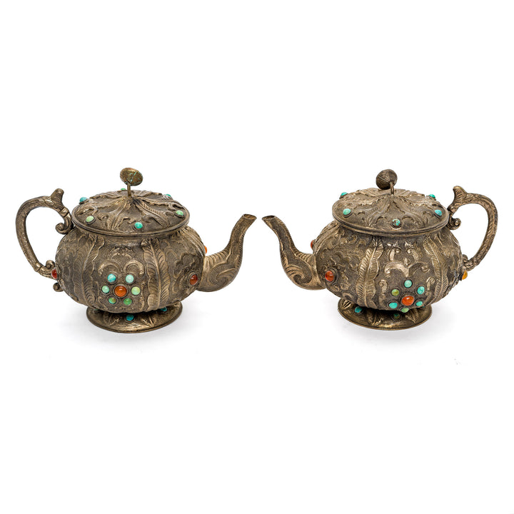 Classic pair of vintage Chinese teapots with detailed craftsmanship