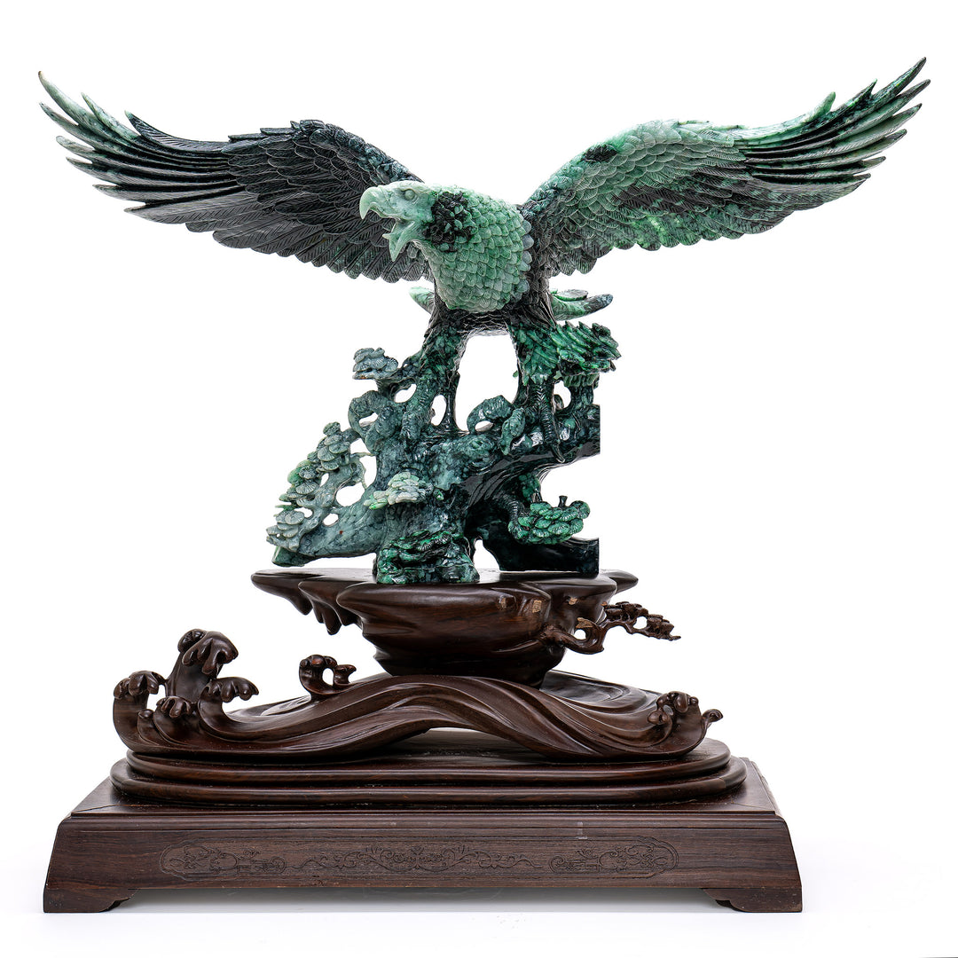 Majestic hand-carved jade eagle soaring mid-flight.