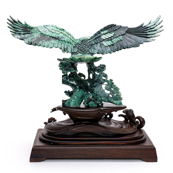 Exquisite jade sculpture symbolizing freedom and strength with a soaring eagle.