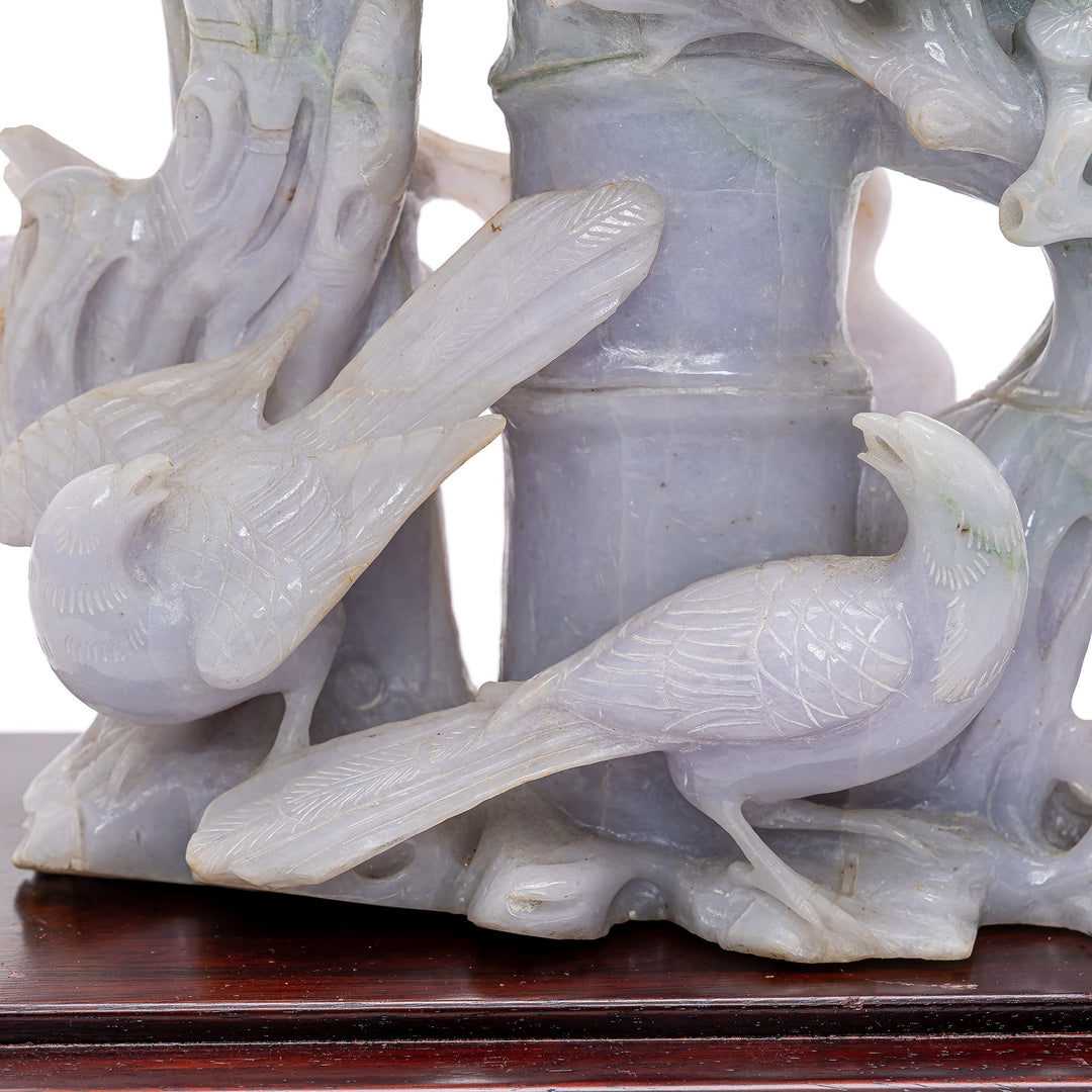 Detailed jade carving symbolizing longevity and endurance with cranes and pines