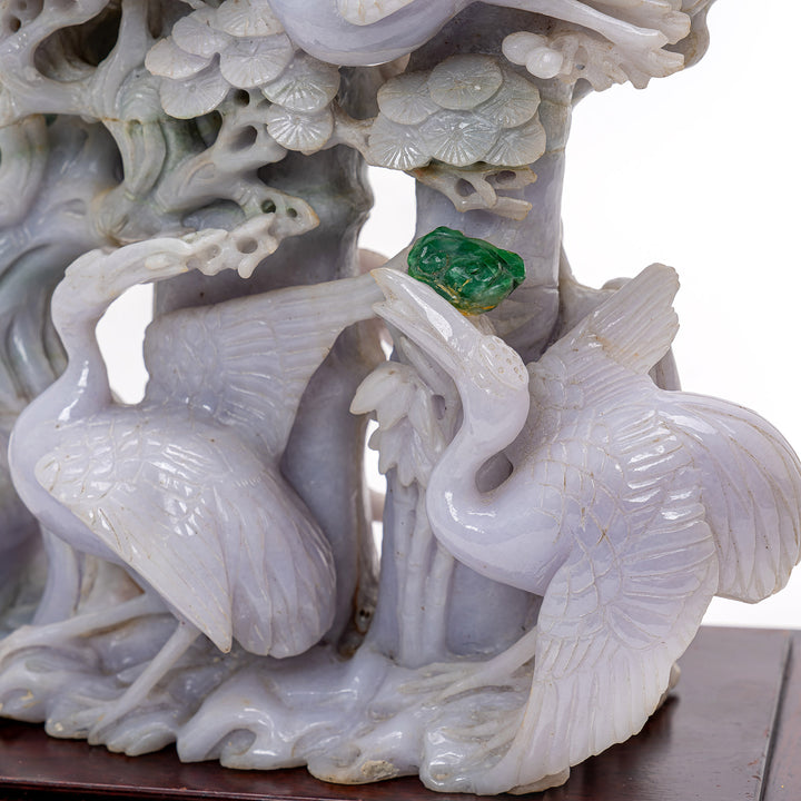 Exquisite jade depiction of cranes and pine trees, blending symbolism and artistry