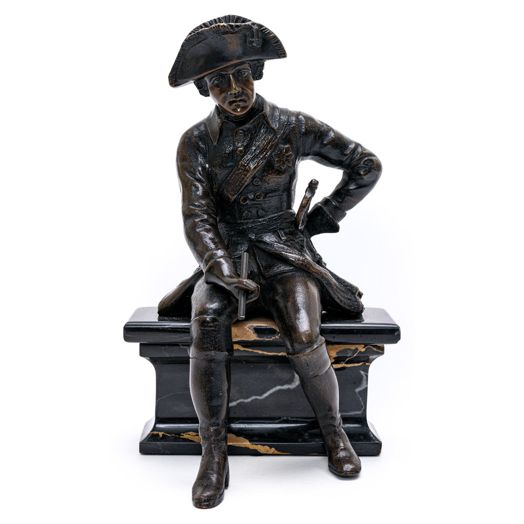 Bronze sculpture of seated Napoleon on marble base
