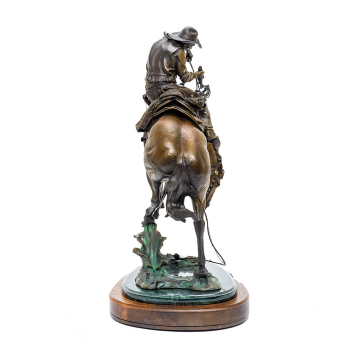 Detailed Western bronze sculpture with rich patina finish