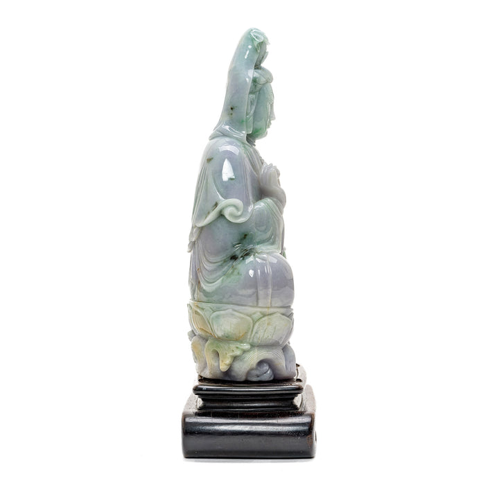Intricate jade statue of Kwan Yin, the beacon of compassion.