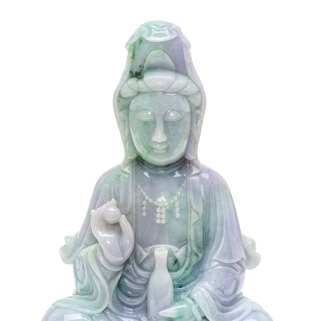 Healing energy jade Kwan Yin sculpture with symbolic details.