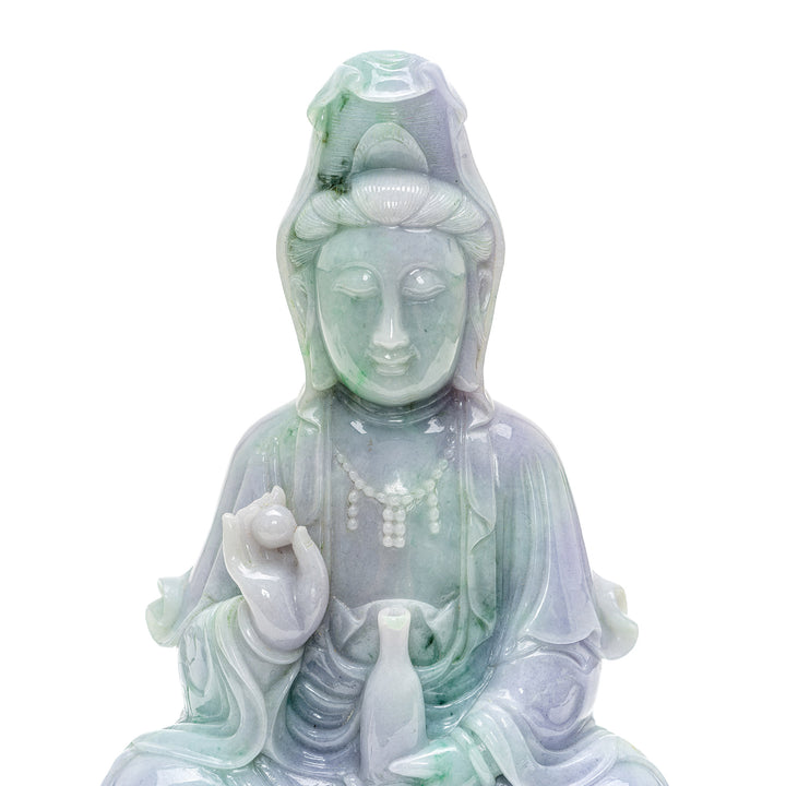 Healing energy jade Kwan Yin sculpture with symbolic details.
