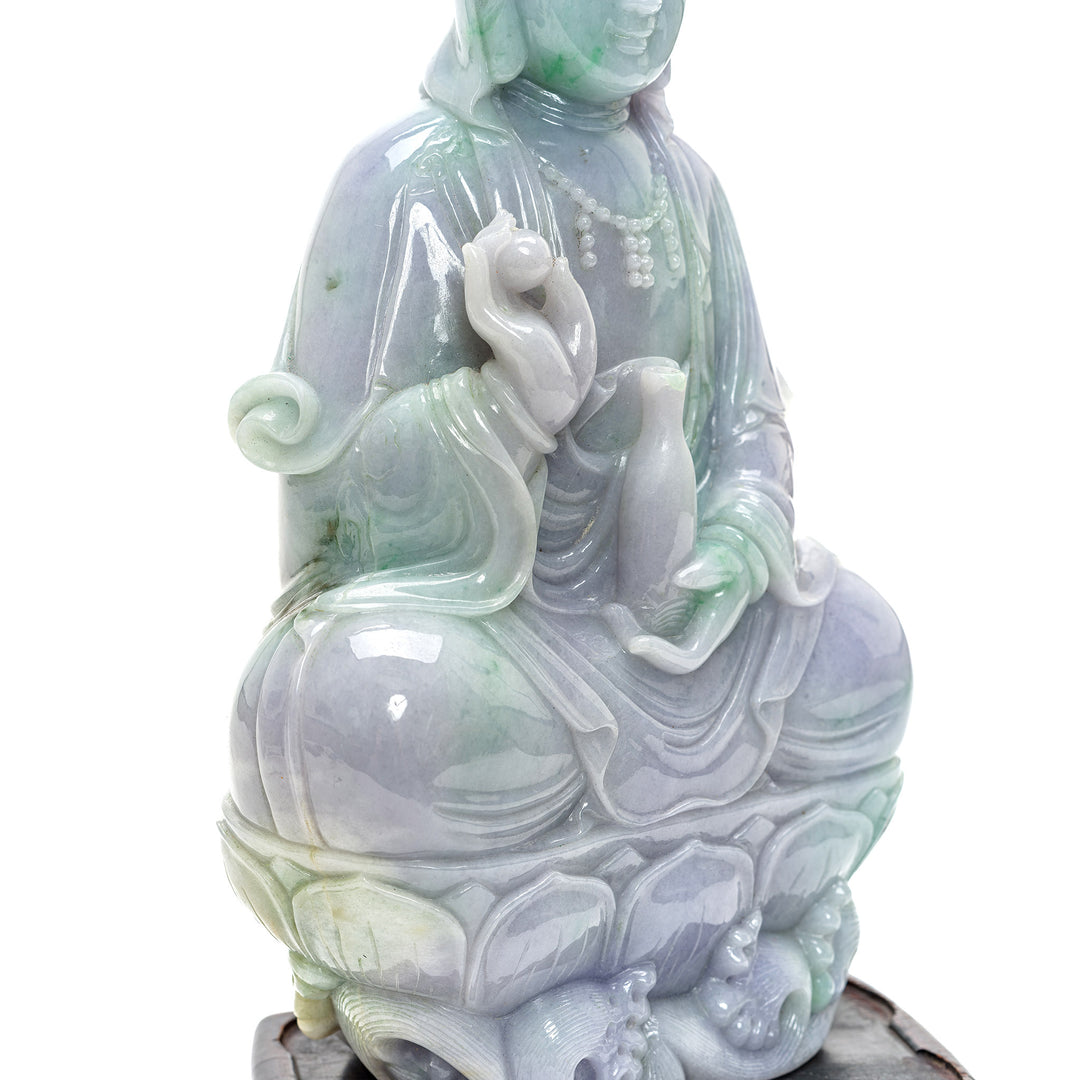 Hand-carved jade depiction of Kwan Yin with enlightening pearl.