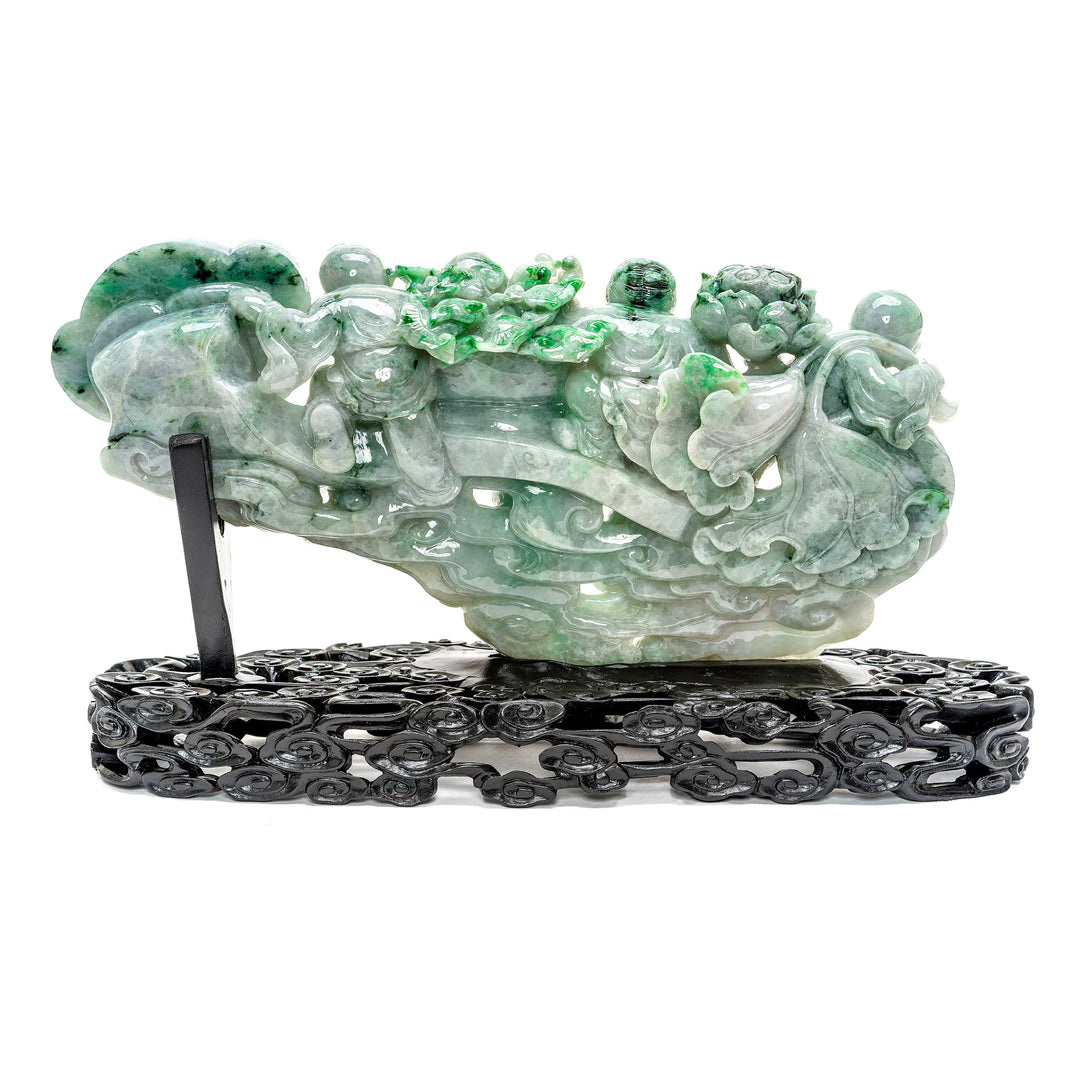 Playful green jade carving of children and scepter.