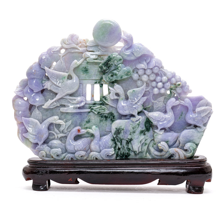 Exquisite jade boulder sculpture depicting geese amidst lush grape vines.