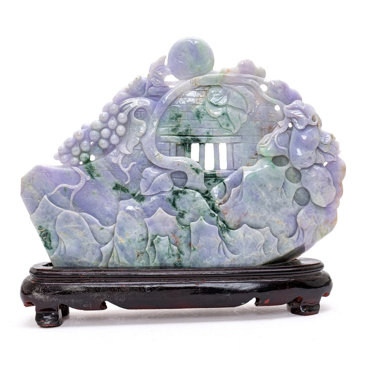 Hand-carved jade masterpiece illustrating a tranquil scene of geese and grape vines.