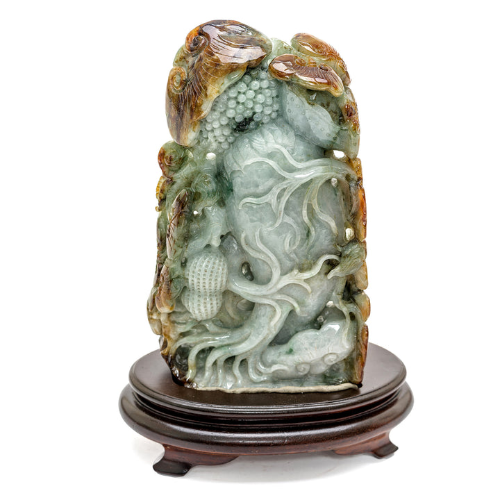 Elegant jade flora sculpture with intricate foliage details.