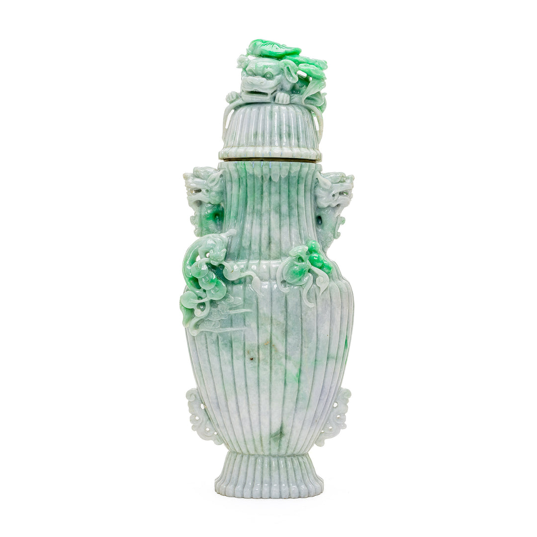 Museum-quality jade vase with apple green and white hues and emerald inclusions.