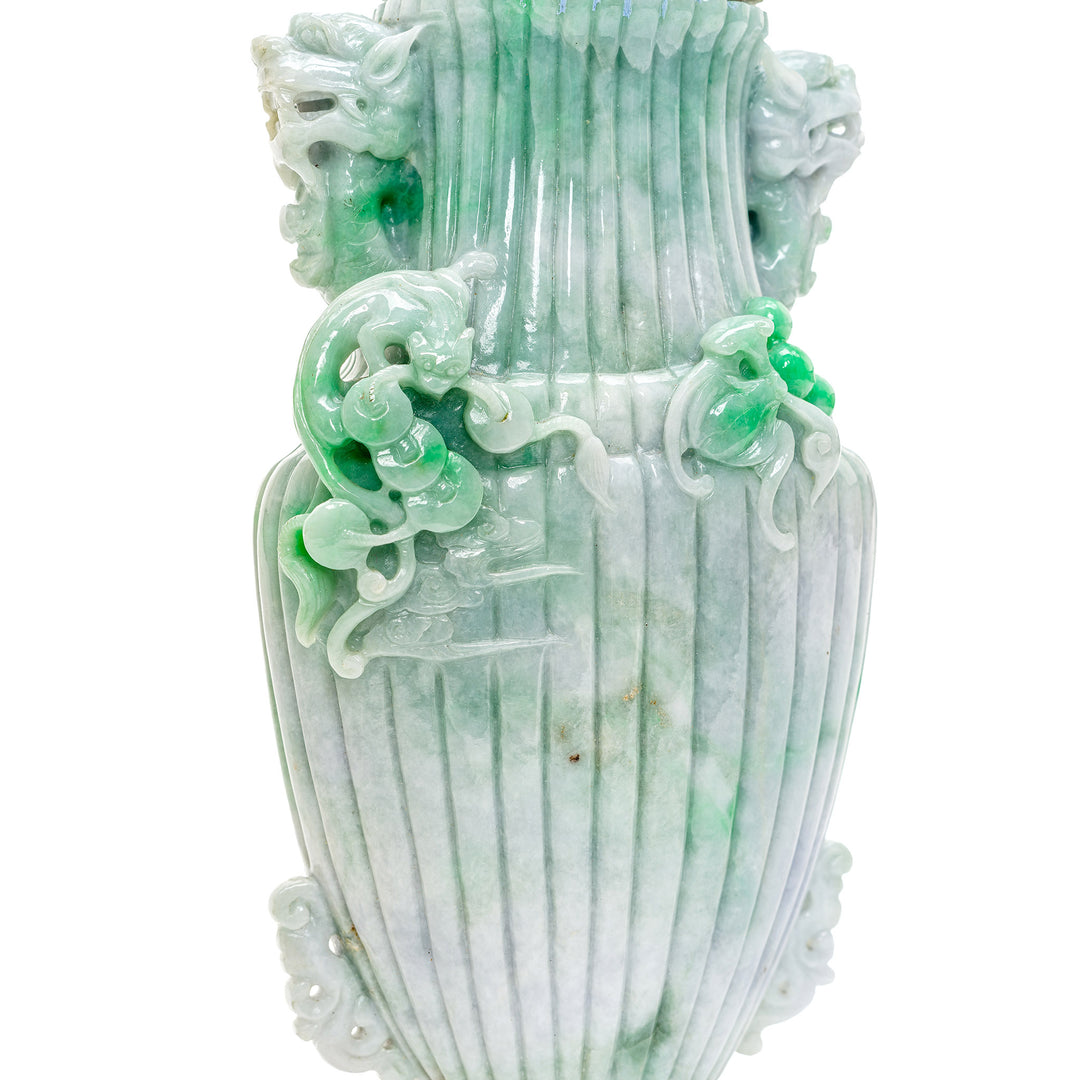 Exquisite jade vase with emerald inclusions, ideal for collectors.