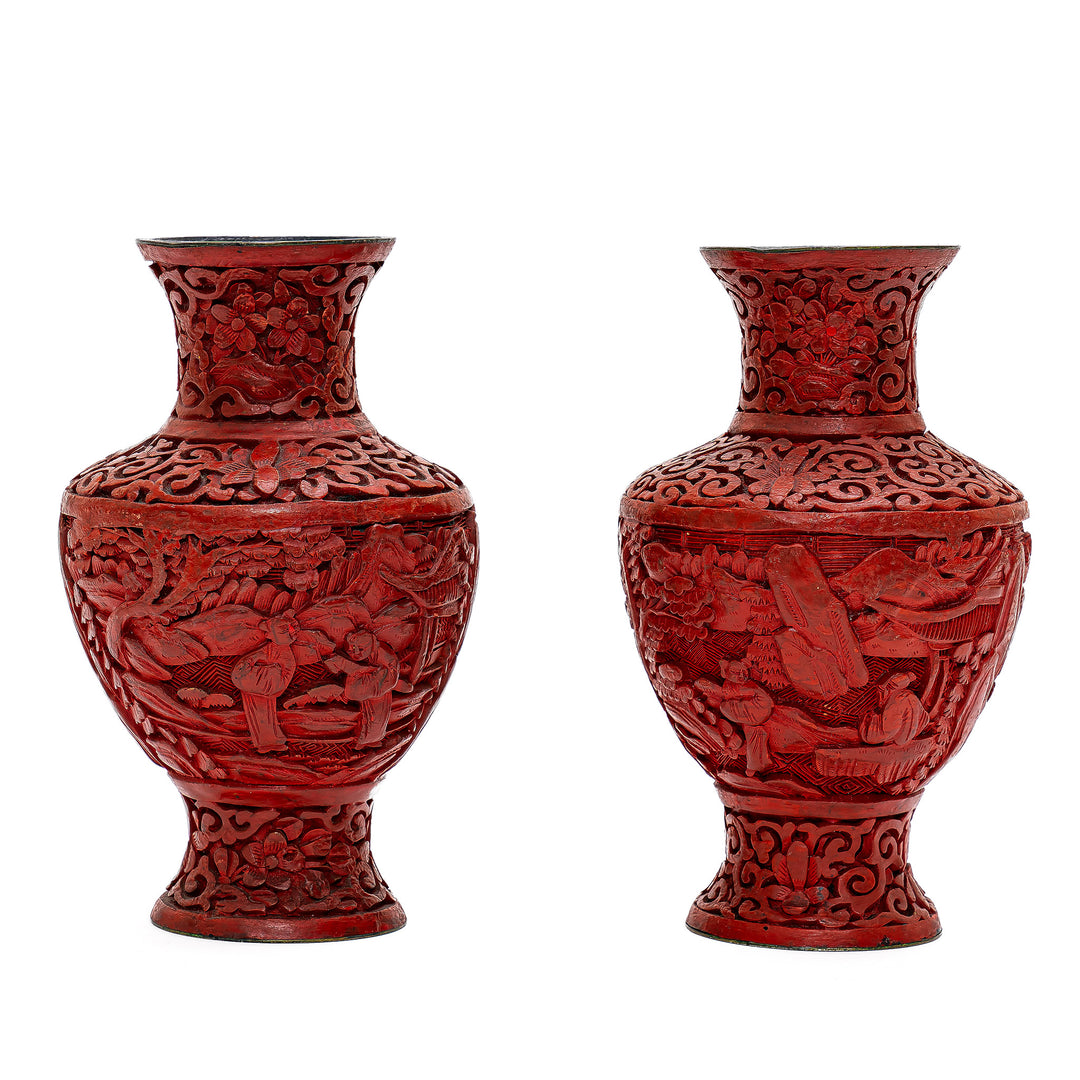 Majestic antique cinnabar vases with intricate carving.