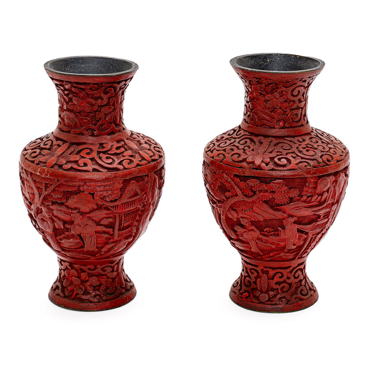 Stunning red lacquer vases showcasing meticulous craftsmanship.