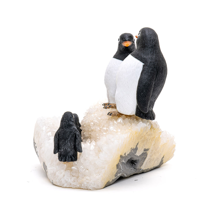 Elegant penguin family statue with natural stone detailing