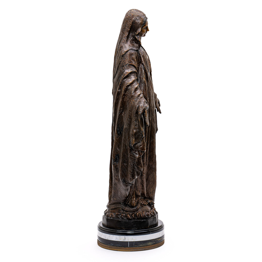 Timeless bronze artwork of Mother Mary's serene visage.