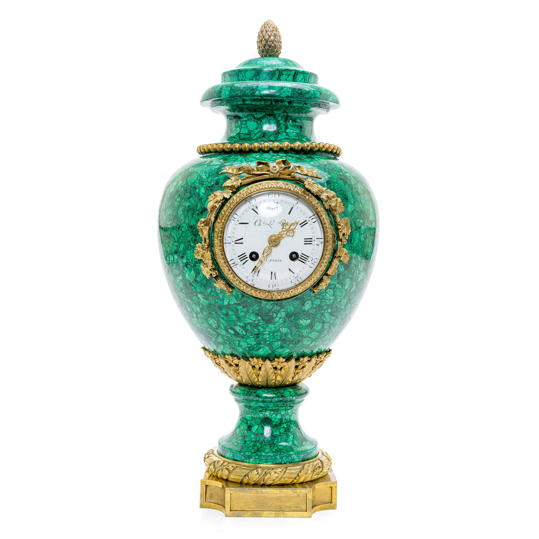 19th-century gem-quality malachite vase clock with doré bronze trim.