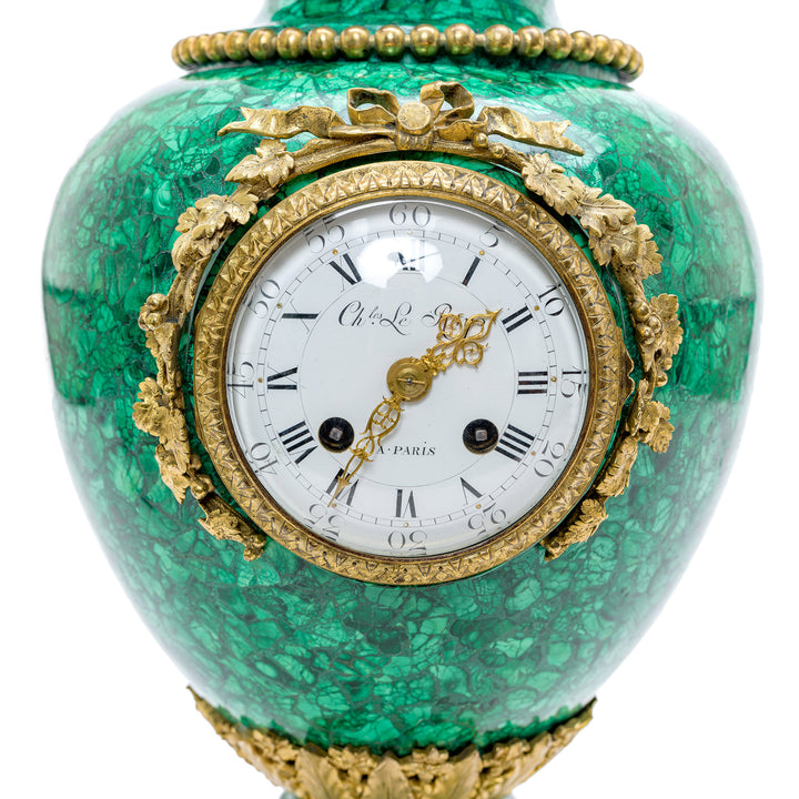 Antique malachite clock vase accentuated with luxurious bronze accents.
