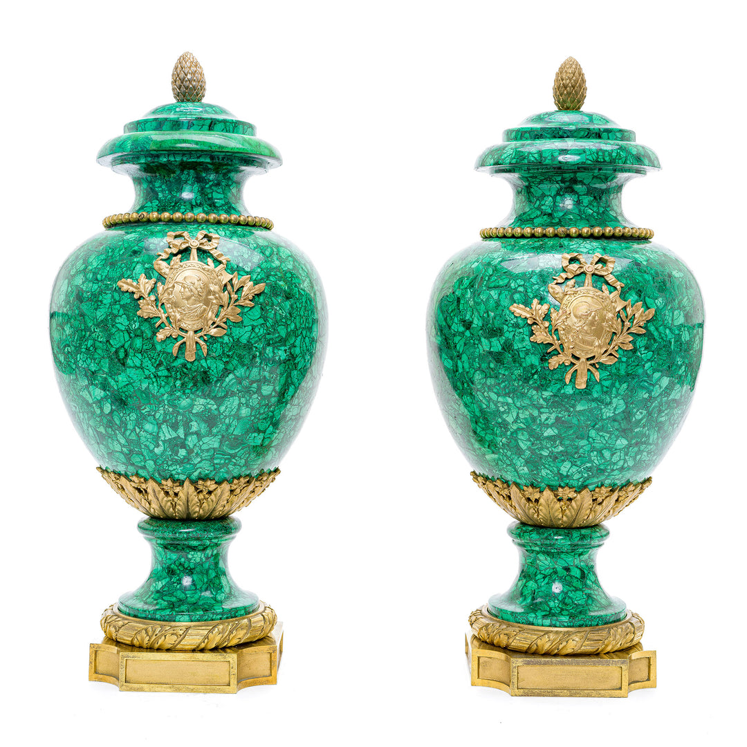 Antique malachite vase pair with chased mounts of Roman bust and laurel wreaths.