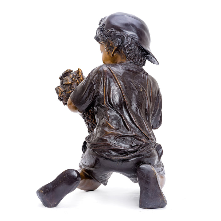 Exquisite bronze artwork of a boy and his Yorkshire terrier.