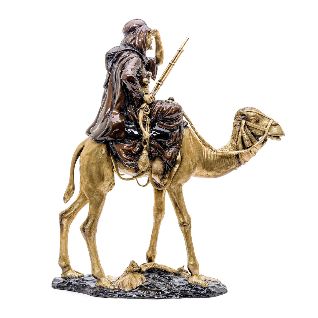 All bronze sculpture of an Arabian figure on a camel, a depiction of desert culture