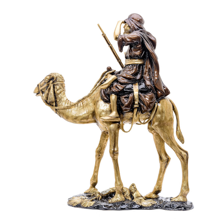 Elegant bronze statue of an Arabian desert nomad riding a camel