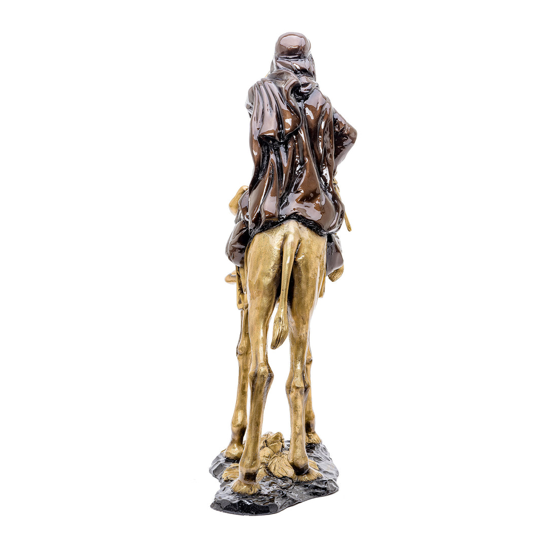 Bronze artwork showcasing the bond between an Arabian traveler and his camel