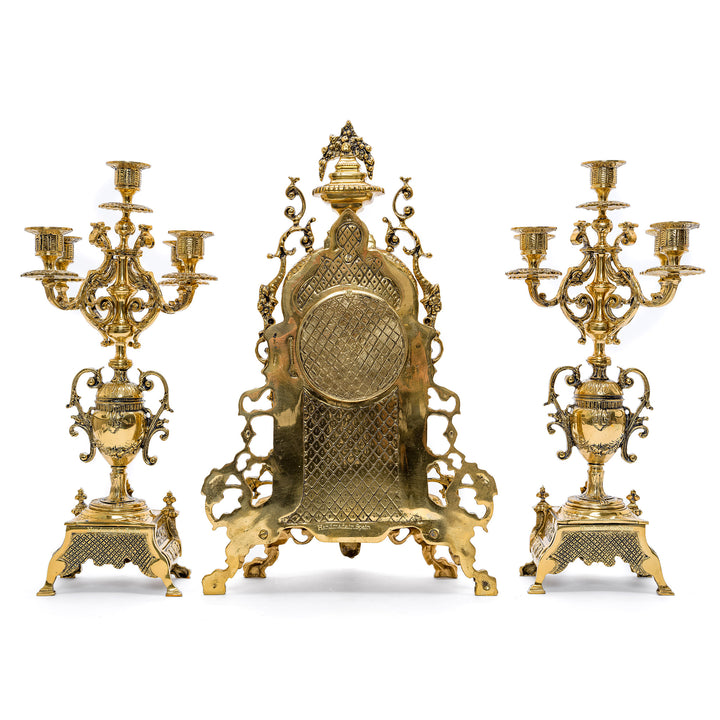 Luxurious Spanish imported bronze clock and candelabra set with neoclassical motifs.