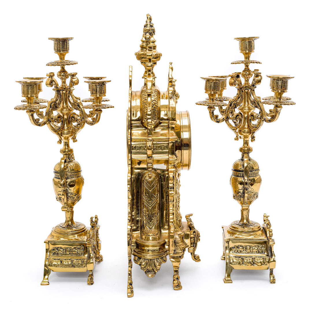 Regis Galerie's exclusive gilt bronze timepiece with matching foliate candelabras.