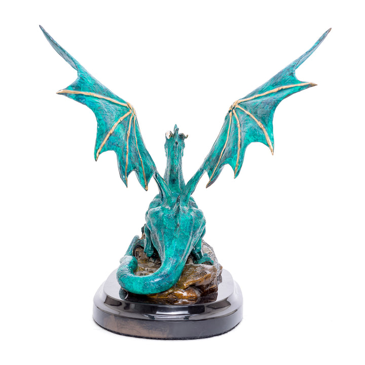 Enchanting bronze dragon statue with turquoise patina wings.