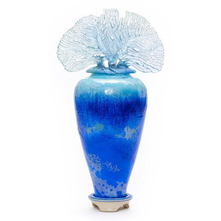 Handcrafted fine art porcelain vase in deep ocean hues with matching finial